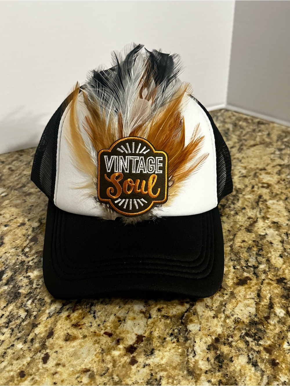 Feather Patch Trucker Hat - Black, White & Brown